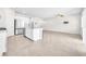 Open concept living space featuring a modern kitchen with stainless steel appliances and a spacious seating area at 9198 Rolling Sky Dr, Las Vegas, NV 89178
