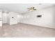 Bright living space with tile flooring, ceiling fan, recessed lighting, and neutral color palette throughout at 9198 Rolling Sky Dr, Las Vegas, NV 89178