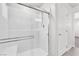 Modern shower with a sliding glass door and white tiled walls in a neutral-toned bathroom at 9198 Rolling Sky Dr, Las Vegas, NV 89178
