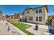 An expansive backyard features artificial turf and stone details, perfect for outdoor enjoyment and easy maintenance at 9413 Steeltree St, Las Vegas, NV 89143
