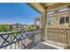 Relaxing balcony view showcasing neighborhood homes and clear blue skies at 9413 Steeltree St, Las Vegas, NV 89143