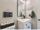Charming powder room featuring a modern vanity, stylish mirror, and cute decorative touches at 9413 Steeltree St, Las Vegas, NV 89143