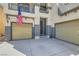 View of the three-car garage and expansive driveway at 9413 Steeltree St, Las Vegas, NV 89143