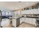 Bright kitchen with white cabinetry, stainless steel appliances, and an adjacent dining area at 9413 Steeltree St, Las Vegas, NV 89143