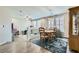 Open concept living area featuring a dining nook and a ' play space with laminate flooring at 9413 Steeltree St, Las Vegas, NV 89143