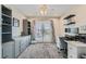 Well-lit home office with custom shelving, storage cabinets, French doors and an abundance of natural light at 9413 Steeltree St, Las Vegas, NV 89143