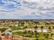 Overhead view of a golf course, ponds, and lush landscaping highlighting the community's serene environment at 9437 January Dr, Las Vegas, NV 89134
