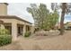 The backyard features low-maintenance landscaping, a covered patio, and a serene atmosphere for relaxation at 9437 January Dr, Las Vegas, NV 89134