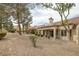 The backyard features low-maintenance landscaping, a covered patio, and a serene atmosphere for relaxation at 9437 January Dr, Las Vegas, NV 89134