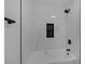 This bathroom features a shower and tub combination with marble-look tile at 9437 January Dr, Las Vegas, NV 89134