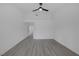 This bedroom has wood floors and a ceiling fan at 9437 January Dr, Las Vegas, NV 89134