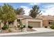 Inviting single-story home with desert landscaping, two-car garage, and tile roof at 9437 January Dr, Las Vegas, NV 89134