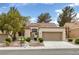 Inviting single-story home with desert landscaping, two-car garage, and tile roof at 9437 January Dr, Las Vegas, NV 89134