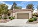 Inviting single-story home with desert landscaping, two-car garage, and tile roof at 9437 January Dr, Las Vegas, NV 89134
