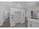Modern kitchen with white cabinets, modern appliances, and an open layout at 9437 January Dr, Las Vegas, NV 89134