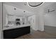 Modern kitchen with white cabinets, quartz countertops, decorative backsplash, and stainless steel appliances at 9437 January Dr, Las Vegas, NV 89134