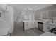Bright, modern kitchen with sleek white cabinets, quartz countertops, stainless steel appliances, and an island at 9437 January Dr, Las Vegas, NV 89134