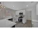 Modern kitchen features quartz countertops, stainless steel appliances, white cabinets, and stylish backsplash at 9437 January Dr, Las Vegas, NV 89134