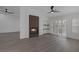 Spacious living room featuring a modern fireplace, light wood floors, shutters, and a ceiling fan at 9437 January Dr, Las Vegas, NV 89134