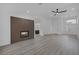 Bright living room featuring a modern fireplace, ceiling fan, and an open floor plan at 9437 January Dr, Las Vegas, NV 89134
