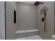 The shower features neutral tile, a built-in bench and shelf, and modern fixtures at 9437 January Dr, Las Vegas, NV 89134