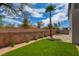 Backyard featuring artificial turf, desert landscaping, and privacy walls at 955 Leadville Meadows Dr, Henderson, NV 89052