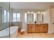Spacious bathroom featuring double sinks, modern tub and stand alone shower at 955 Leadville Meadows Dr, Henderson, NV 89052