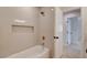 Modern bathroom with a white tiled shower and tub at 955 Leadville Meadows Dr, Henderson, NV 89052