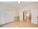 Large empty room with open doorways, closet and wood floor at 955 Leadville Meadows Dr, Henderson, NV 89052