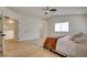 Bright bedroom featuring a ceiling fan, hardwood floors and large window at 955 Leadville Meadows Dr, Henderson, NV 89052