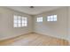 Bedroom with wood floors and natural light from windows at 955 Leadville Meadows Dr, Henderson, NV 89052