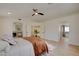 Open bedroom with hardwood floors leading to fireplace and bathroom at 955 Leadville Meadows Dr, Henderson, NV 89052