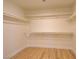 Walk in closet with multiple shelves and hardwood floors at 955 Leadville Meadows Dr, Henderson, NV 89052