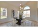 Well-lit dining area featuring stylish decor, modern lighting, and large windows offering outdoor views at 955 Leadville Meadows Dr, Henderson, NV 89052