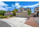Well-kept home with a three-car garage, landscaped front yard, and a neatly paved driveway at 955 Leadville Meadows Dr, Henderson, NV 89052