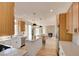 Well-designed kitchen boasts stainless steel appliances, a center island with bar seating, and connects to the living area at 955 Leadville Meadows Dr, Henderson, NV 89052