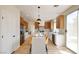 Spacious kitchen features stainless steel appliances, quartz countertops, and a large center island with seating at 955 Leadville Meadows Dr, Henderson, NV 89052