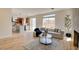 Open-concept living room seamlessly connects to the kitchen, boasting large windows and modern finishes throughout at 955 Leadville Meadows Dr, Henderson, NV 89052