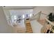Bright living room with high ceilings, wood floors, modern decor, and staircase at 955 Leadville Meadows Dr, Henderson, NV 89052