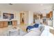 Bright, open living room boasts hardwood floors, modern decor, and seamlessly connects to the kitchen for easy entertaining at 955 Leadville Meadows Dr, Henderson, NV 89052
