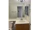 Bright bathroom featuring vanity with sink, toilet and view into bedroom at 9839 Brook Canyon Dr, Las Vegas, NV 89147