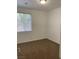 Bright bedroom featuring neutral walls, carpeted floors, and a window with blinds for natural light at 9839 Brook Canyon Dr, Las Vegas, NV 89147