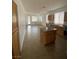 Open kitchen and living area with tile floors and natural light at 9839 Brook Canyon Dr, Las Vegas, NV 89147