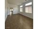 Bright living room with tile flooring and large windows at 9839 Brook Canyon Dr, Las Vegas, NV 89147