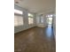 Open living area with tile floors, neutral walls, and natural light from large windows at 9839 Brook Canyon Dr, Las Vegas, NV 89147