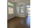 Open concept living room with high ceilings and large windows at 9839 Brook Canyon Dr, Las Vegas, NV 89147