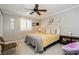 Bright bedroom with plantation shutters and ceiling fan at 9953 Fletcher Peak Ave, Las Vegas, NV 89178