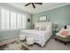 Serene bedroom with neutral tones, shuttered windows and plush carpeting for a relaxing retreat at 9953 Fletcher Peak Ave, Las Vegas, NV 89178