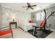 Well-lit bedroom with exercise equipment, neutral carpet, and a simple yet functional design at 9953 Fletcher Peak Ave, Las Vegas, NV 89178