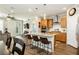 Modern kitchen with granite island, stainless steel appliances, and wood flooring in an open layout at 9953 Fletcher Peak Ave, Las Vegas, NV 89178